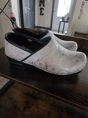 Sanita White Floral-Embossed Leather Clogs with Black Trim